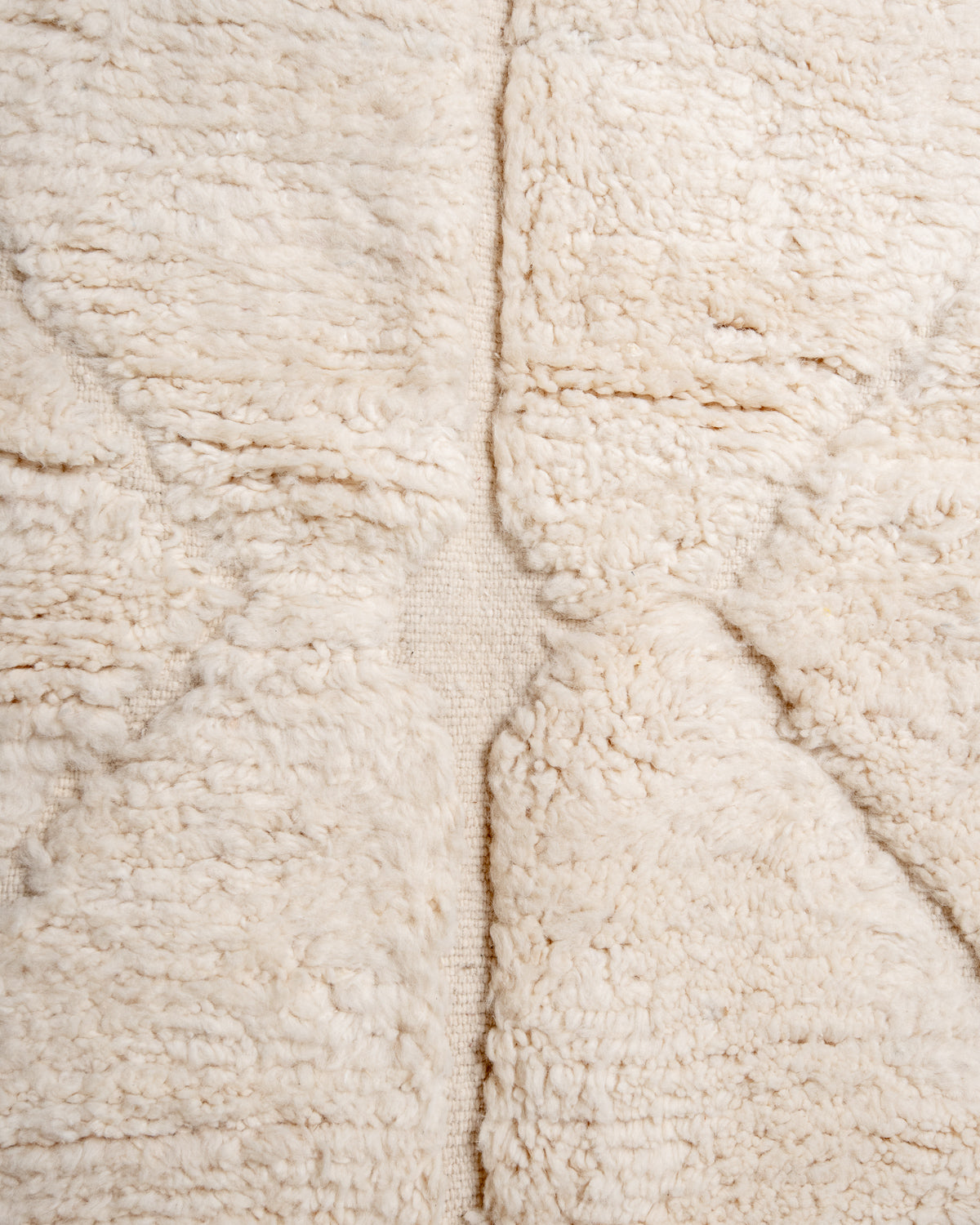 Modern, designer, handcrafted Berber rug from Morocco. Beniourain carpet with minimalist design, natural wool pile and a fluffy texture.
